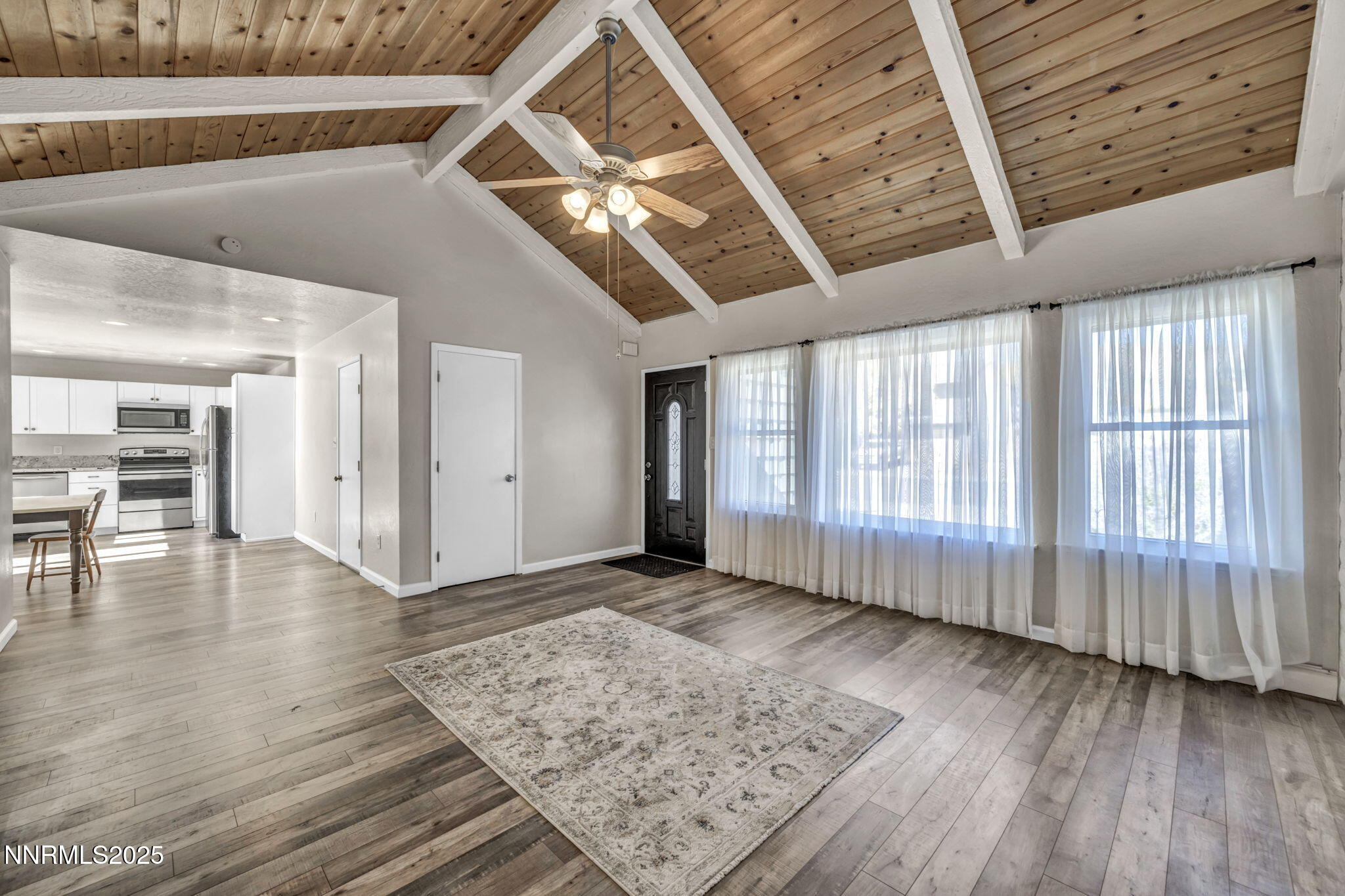 11 Castle Way Carson City, NV 89706 - Photo 7 of 34 a view of an empty room with wooden floor and a window