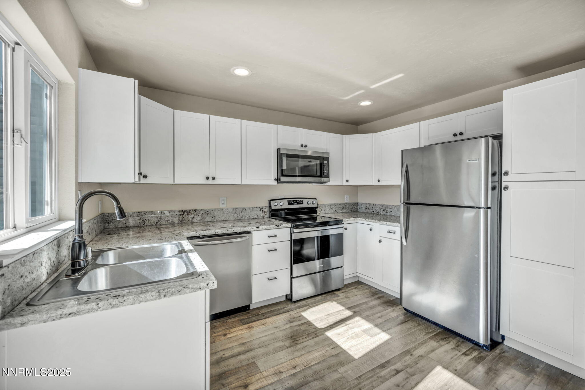 11 Castle Way Carson City, NV 89706 - Photo 10 of 34 a kitchen with granite countertop stainless steel appliances a refrigerator sink and cabinets