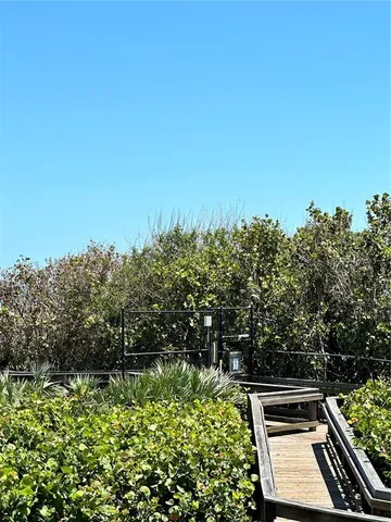a terrace with a wooden wall