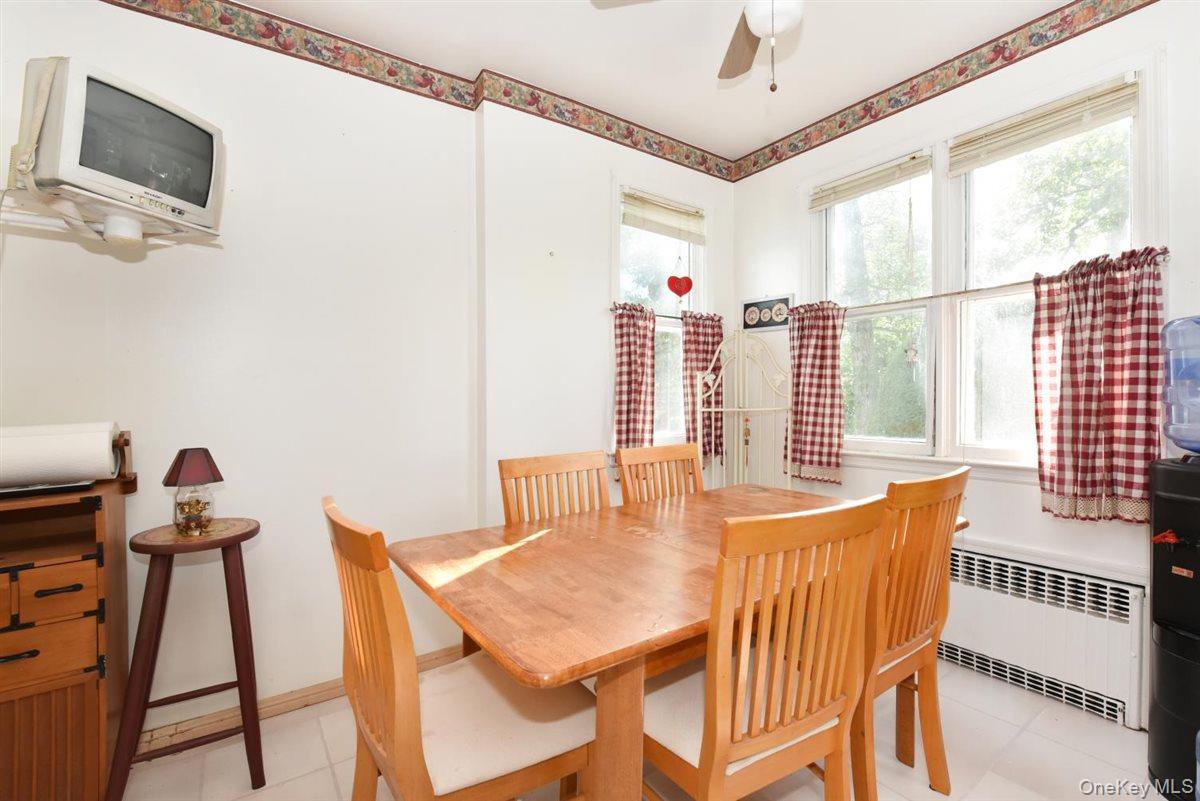101 Wallace Street Freeport, NY 11520 - Photo 11 of 37 a dining room with furniture and window