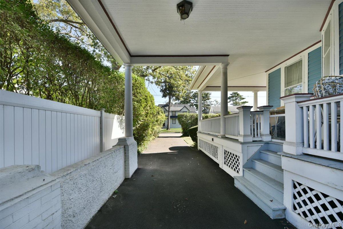 101 Wallace Street Freeport, NY 11520 - Photo 15 of 37 a view of a porch with furniture and garden
