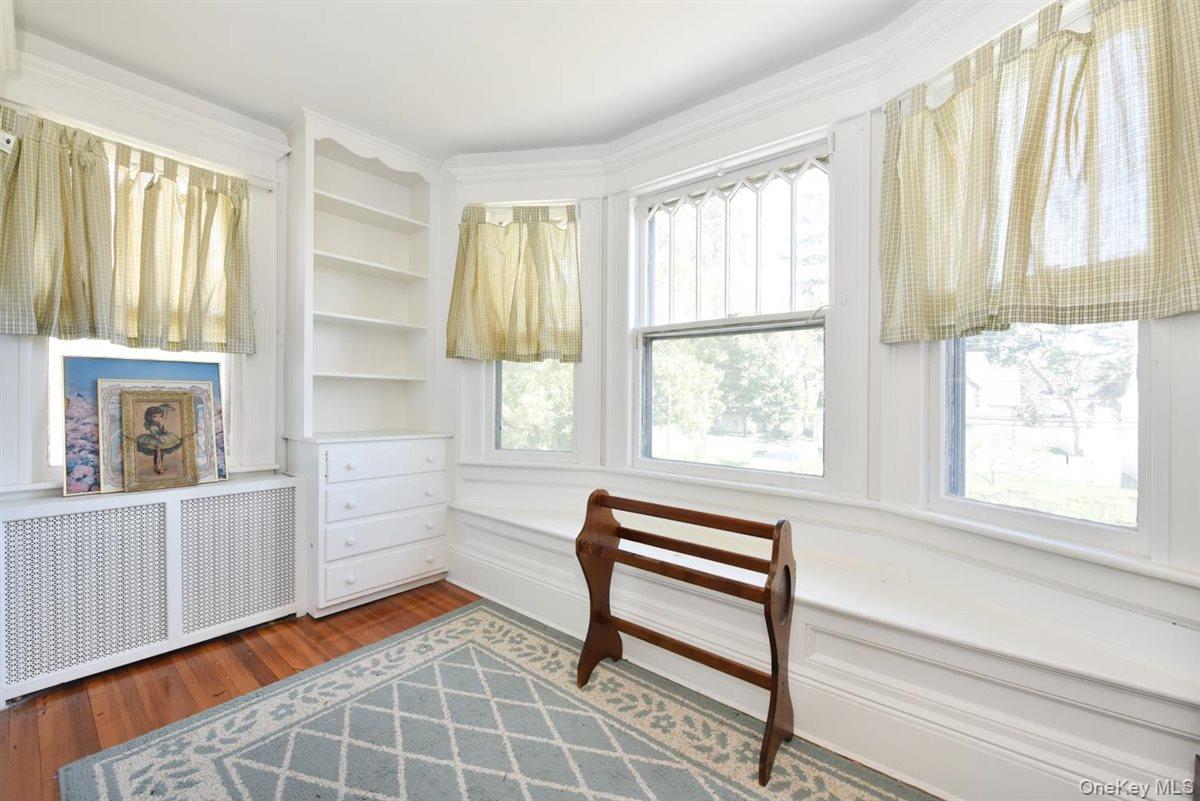 101 Wallace Street Freeport, NY 11520 - Photo 19 of 37 a bedroom with furniture and a window