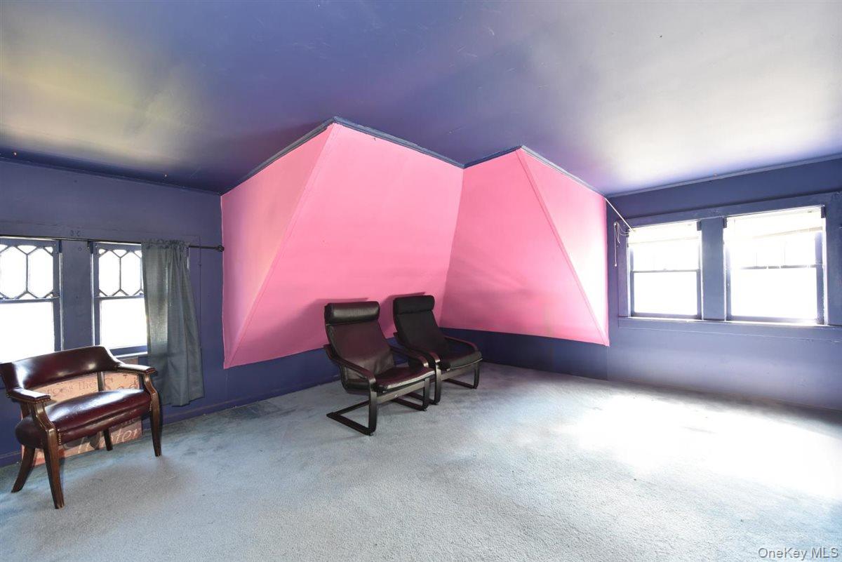 101 Wallace Street Freeport, NY 11520 - Photo 24 of 37 a living room with furniture and a window