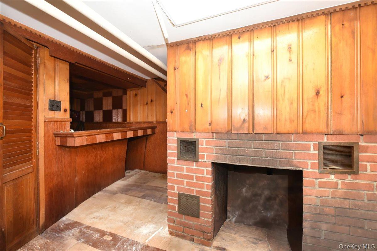 101 Wallace Street Freeport, NY 11520 - Photo 28 of 37 a view of a living room a fireplace