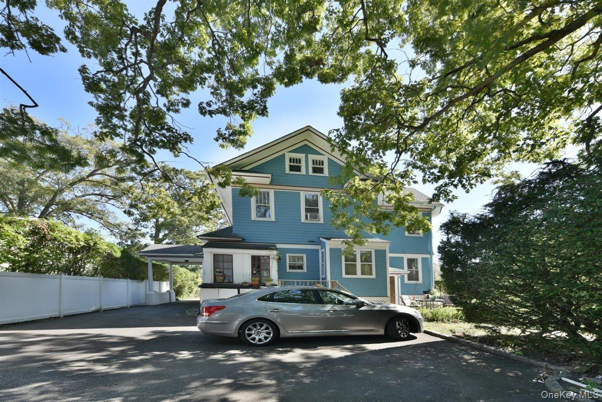 101 Wallace Street Freeport, NY 11520 - Photo 31 of 37 a front view of a house with parking space
