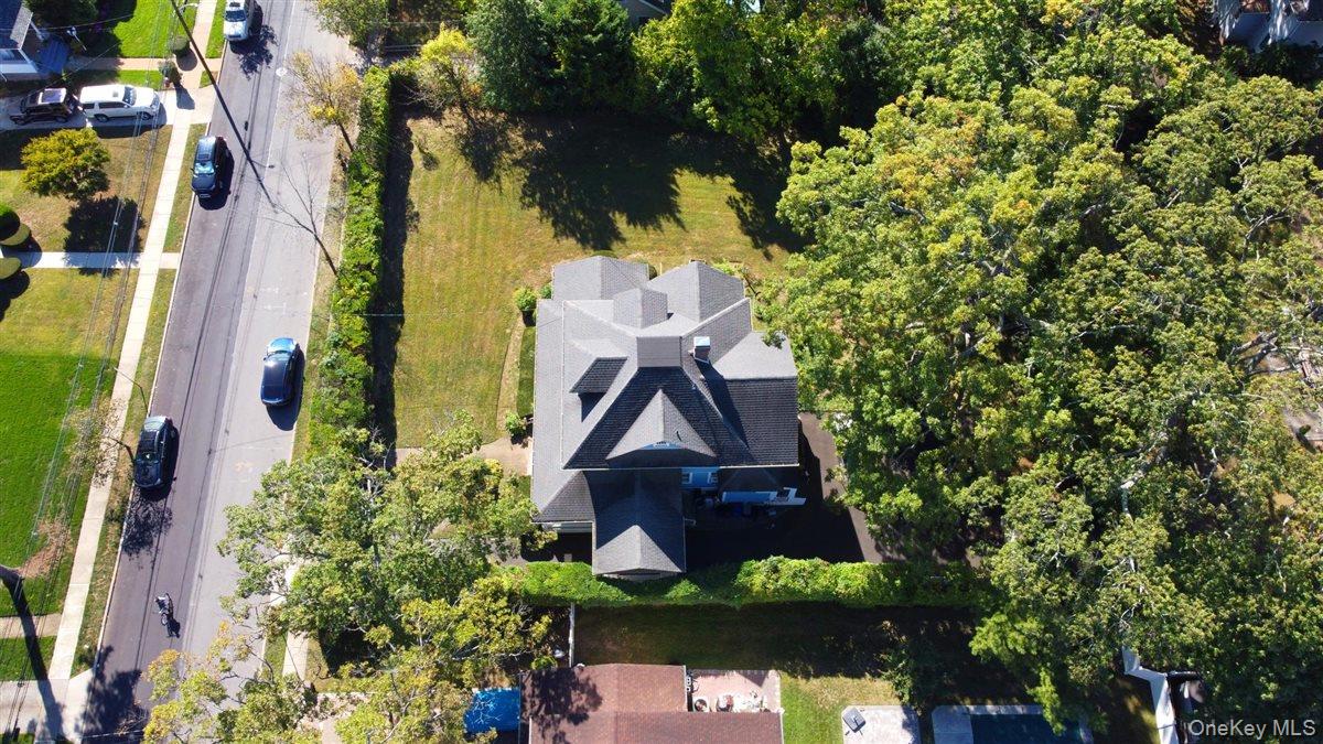 101 Wallace Street Freeport, NY 11520 - Photo 32 of 37 an aerial view of house with yard swimming pool and outdoor seating