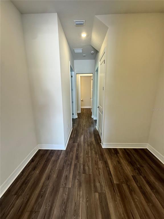 8441 Pk Clf Way Orlando, FL 32836 - Photo 51 of 59 a view of a room with wooden floor and a window