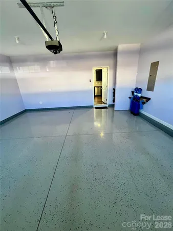 a view of a livingroom with an empty space and a couch