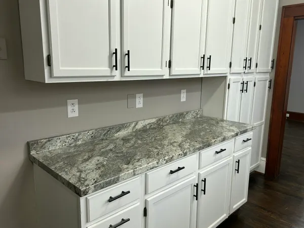 a stove top oven sitting inside of a kitchen
