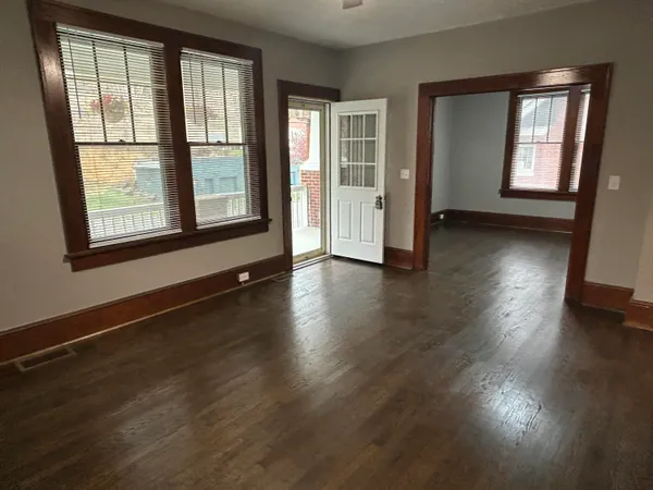 a view of room with wooden floor