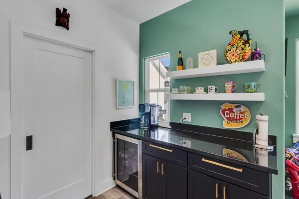 a store room with lots of clutter and cabinets