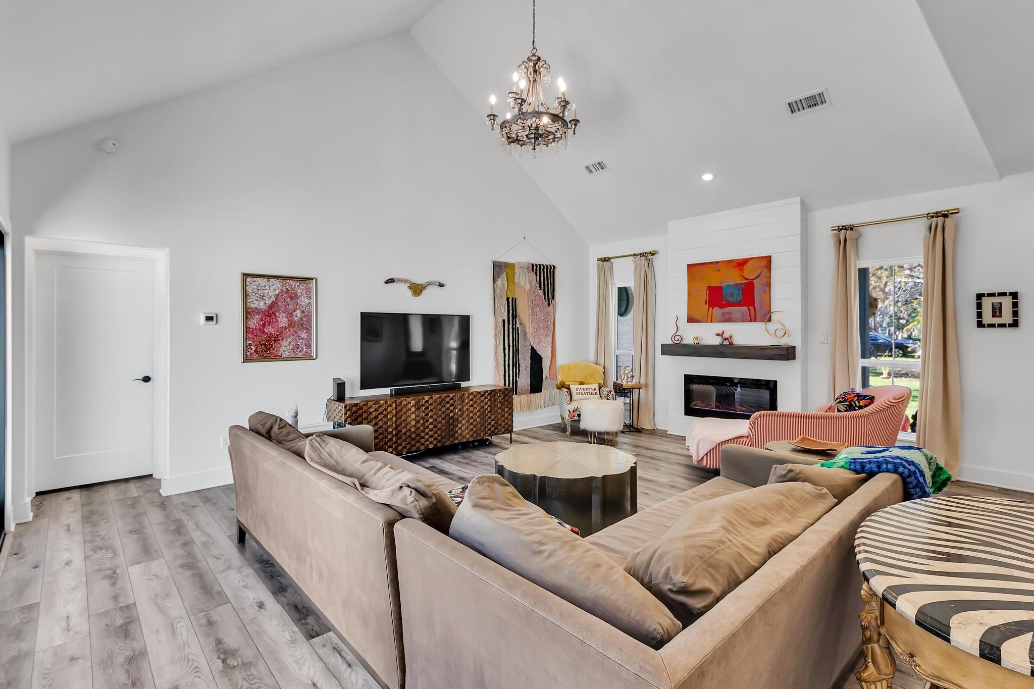 295 County Road 687 Angleton, TX 77515 - Photo 27 of 38 This spacious living room features high vaulted ceilings and abundant natural light.