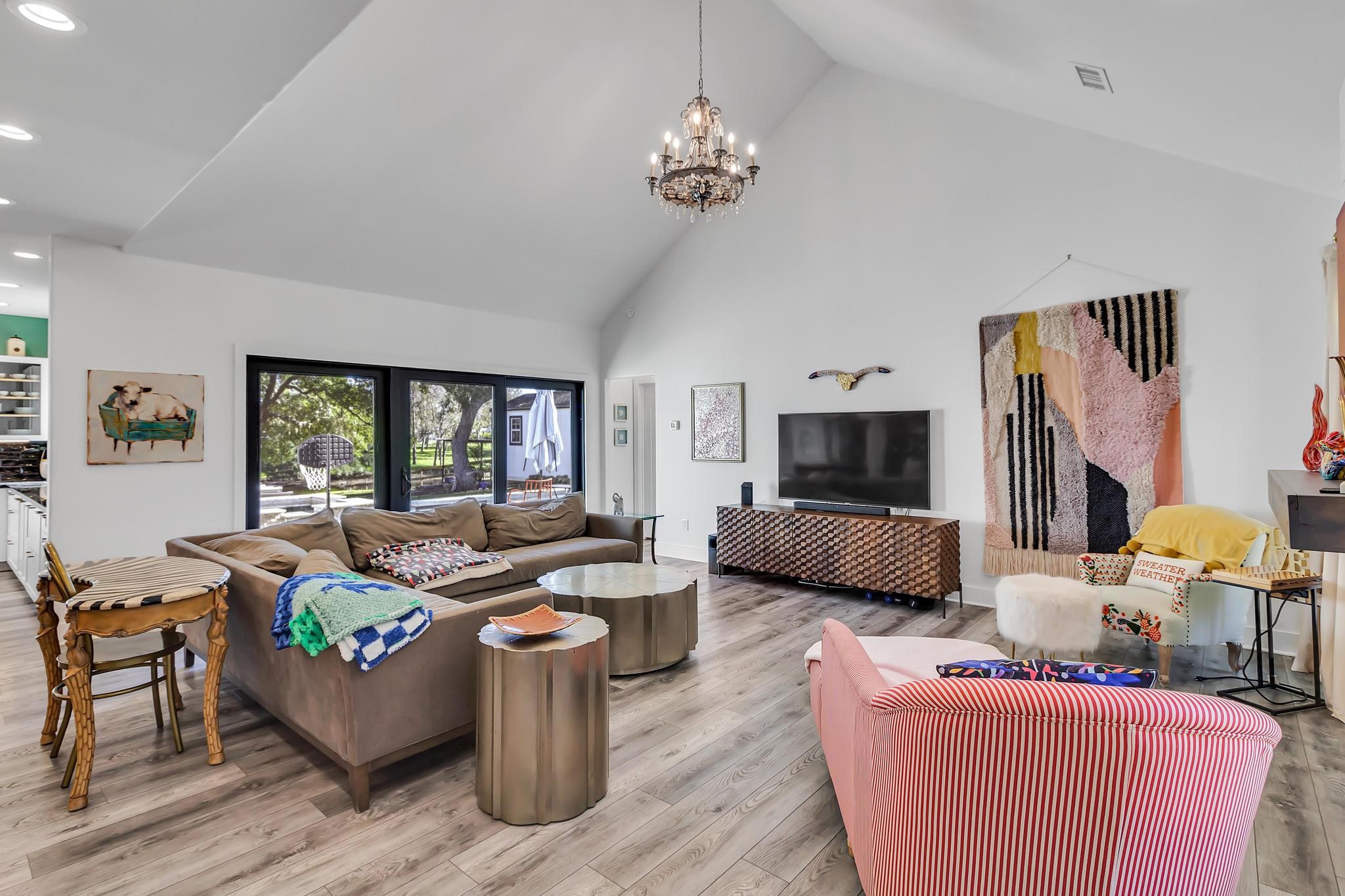 295 County Road 687 Angleton, TX 77515 - Photo 28 of 38 A welcoming and stylish space for relaxation and entertainment. Check out the great views through the large windows and sliding door.