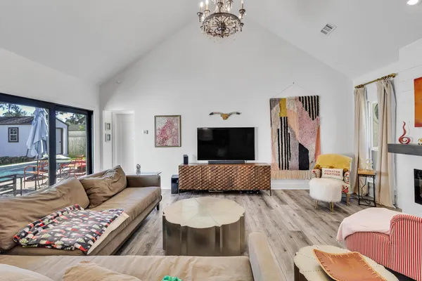 a bedroom with a bed and a lamp