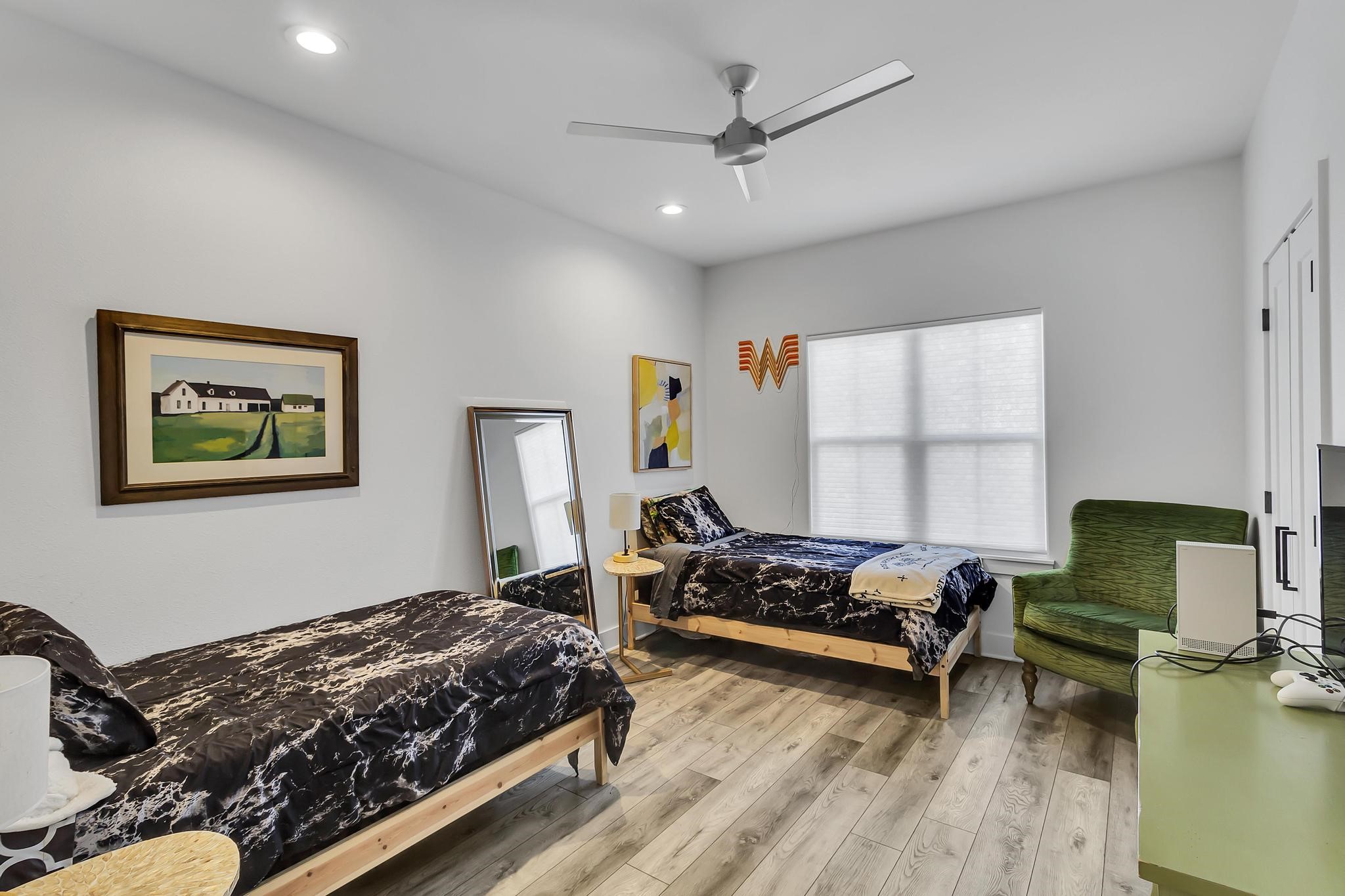 295 County Road 687 Angleton, TX 77515 - Photo 35 of 38 This bedroom is well-lit with recessed lighting and natural light from a large window.
