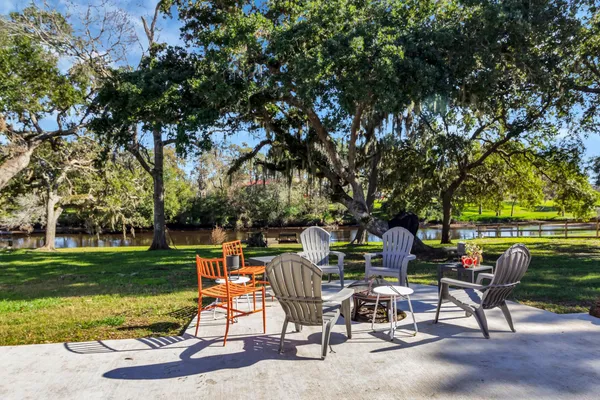 a view of a tables and chairs in a patio