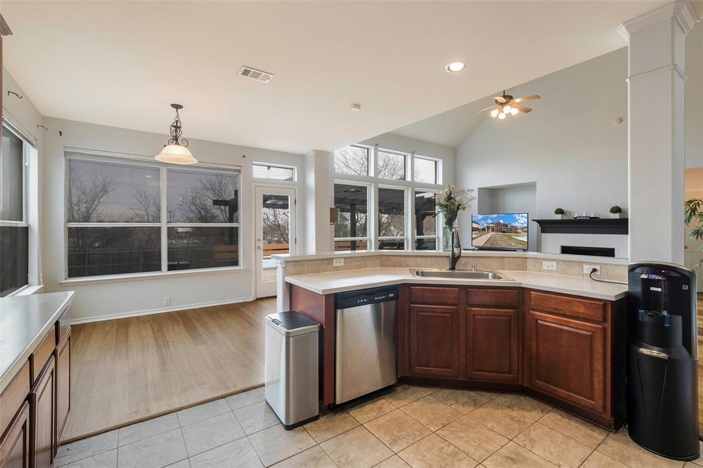 3010 St Joseph Drive Mansfield, TX 76063 - Photo 33 of 33 a large kitchen with kitchen island a sink stainless steel appliances and cabinets