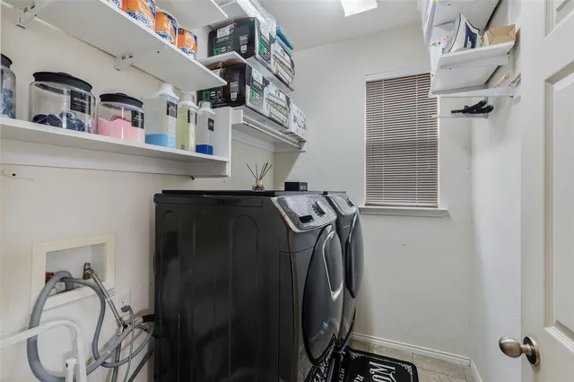 a kitchen with granite countertop a sink stainless steel appliances and cabinets