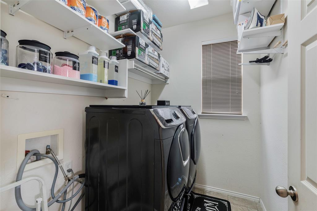 3010 St Joseph Drive Mansfield, TX 76063 - Photo 14 of 33 a view of walk in closet with clothes and shoes