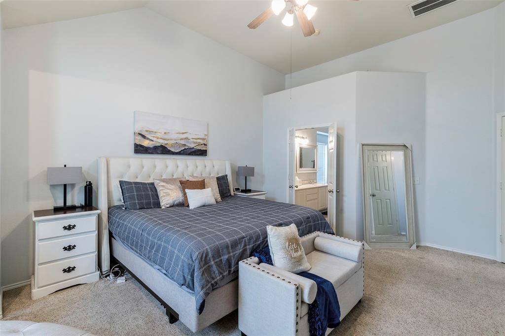 3010 St Joseph Drive Mansfield, TX 76063 - Photo 15 of 33 a bedroom with a bed and a chandelier