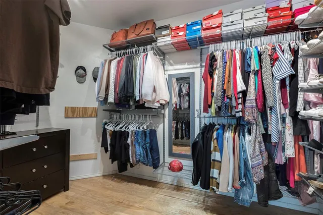 a bathroom with a sink a large mirror and a bathtub