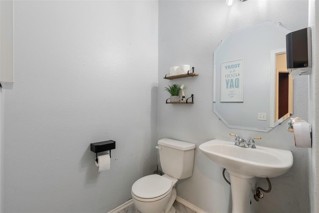 3010 St Joseph Drive Mansfield, TX 76063 - Photo 23 of 33 a bathroom with a toilet sink and mirror