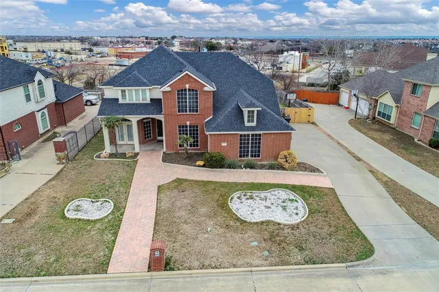 an aerial view of residential houses with outdoor space