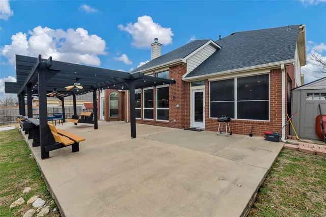 a swimming pool with outdoor seating and balcony