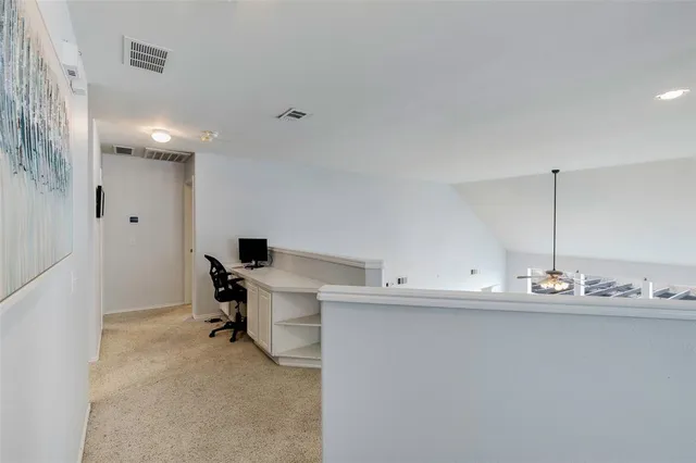 a view of a kitchen with a sink and cabinets