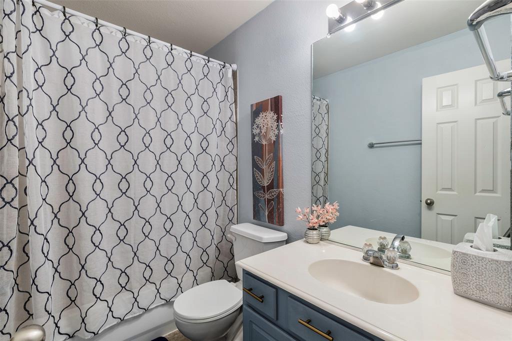 3010 St Joseph Drive Mansfield, TX 76063 - Photo 8 of 33 a bathroom with a sink and a toilet
