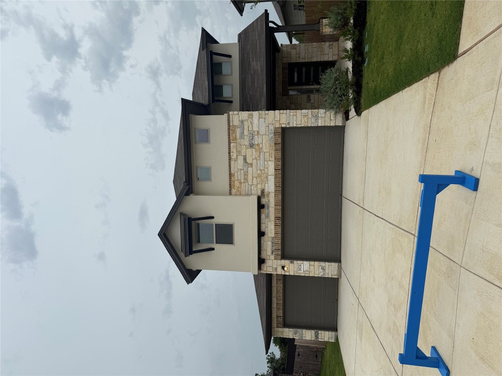 a front view of a house with garage