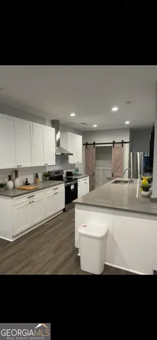 a view of kitchen with wooden floor