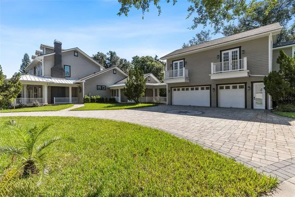 a kitchen with stainless steel appliances granite countertop a refrigerator a stove a sink a oven and a oven
