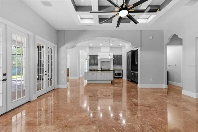 a view of kitchen with stainless steel appliances a stove top oven