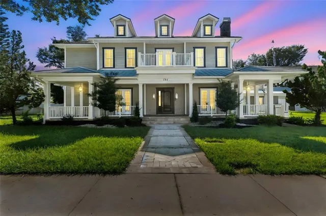a front view of house with yard and green space