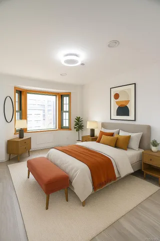 a bedroom with bed and window