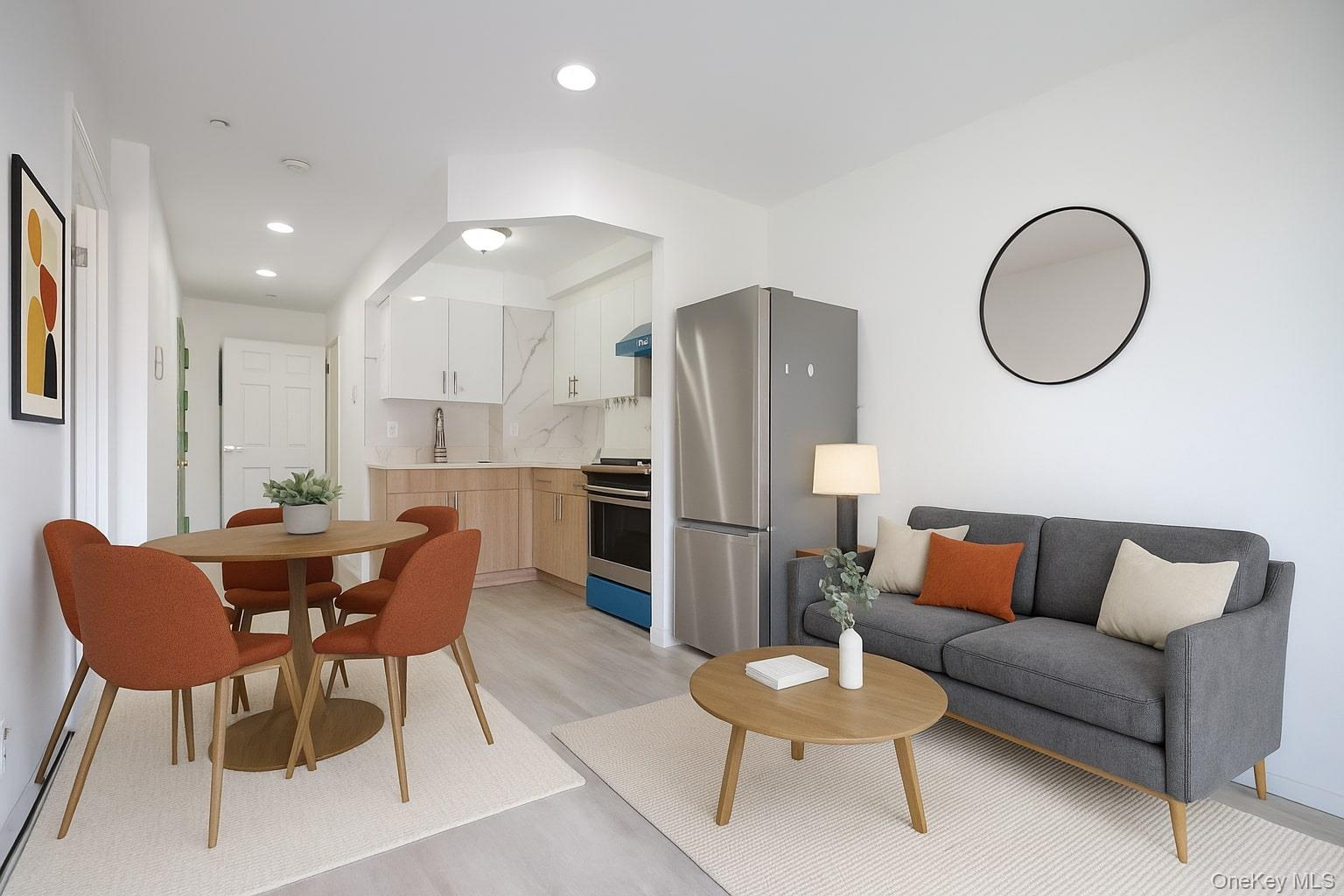 134-43 Maple Avenue, Unit 5B Queens, NY 11355 - Photo 13 of 13 a living room with furniture kitchen view and a wooden floor