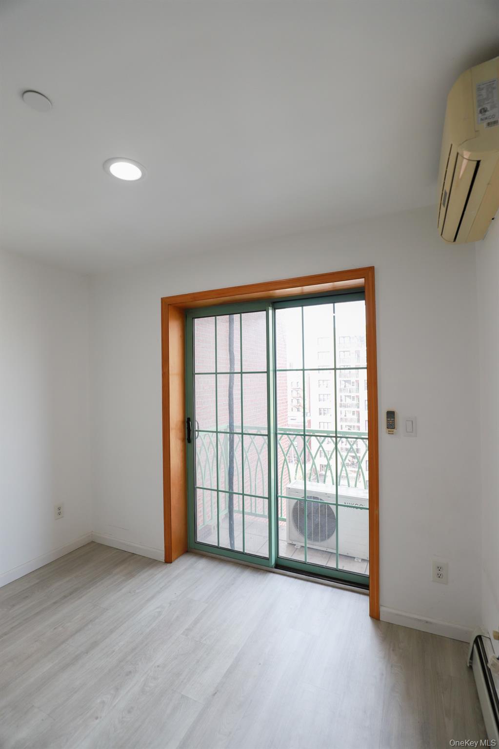 134-43 Maple Avenue, Unit 5B Queens, NY 11355 - Photo 8 of 13 a view of an empty room with a window