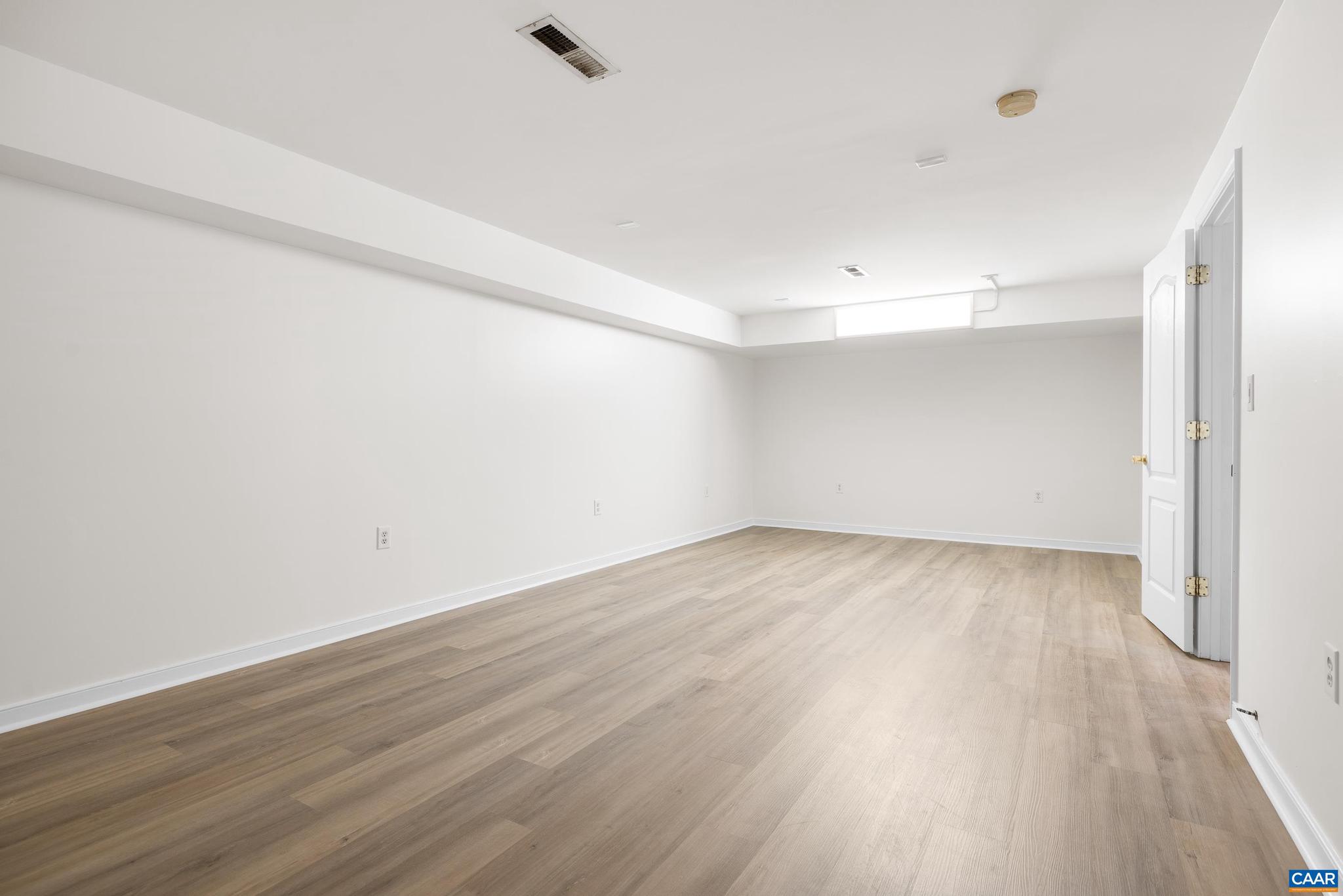 1075 Social Hall Road New Canton, VA 23123 - Photo 18 of 64 a view of an empty room with wooden floor