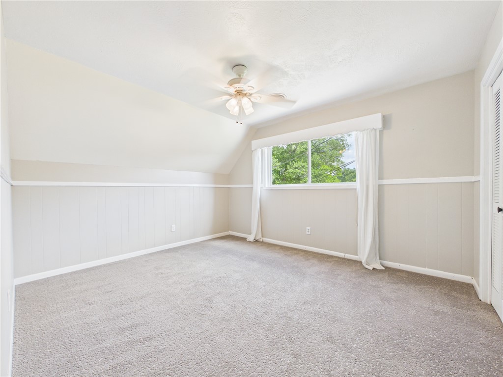 902 Briar Bend Court Bryan, TX 77802 - Photo 31 of 39 an empty room with windows and ceiling fan view