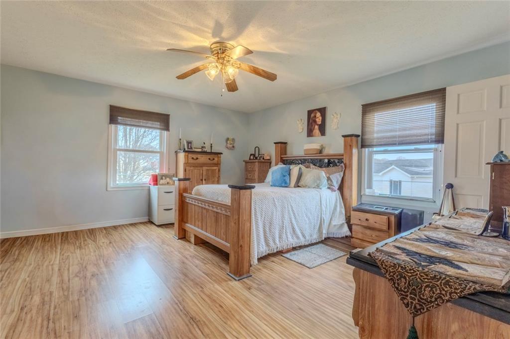 160 Highway 320 Carnesville, GA 30521 - Photo 14 of 68 a bedroom with two beds and a chandelier