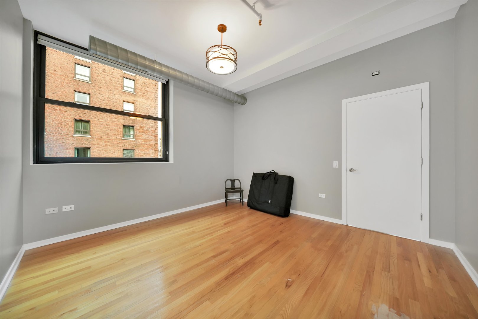 6 East Monroe Street, Unit 1501 Chicago, IL 60603 - Photo 16 of 27 a view of an empty room with a window