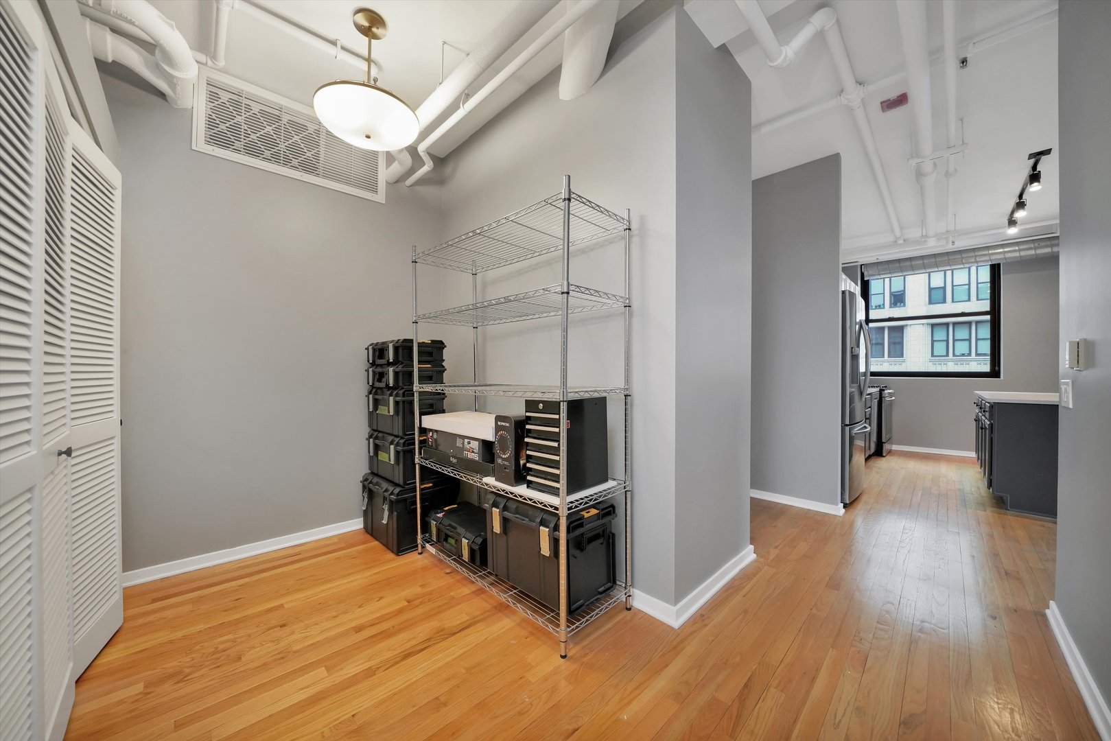6 East Monroe Street, Unit 1501 Chicago, IL 60603 - Photo 17 of 27 a view of a room with wooden floor and windows