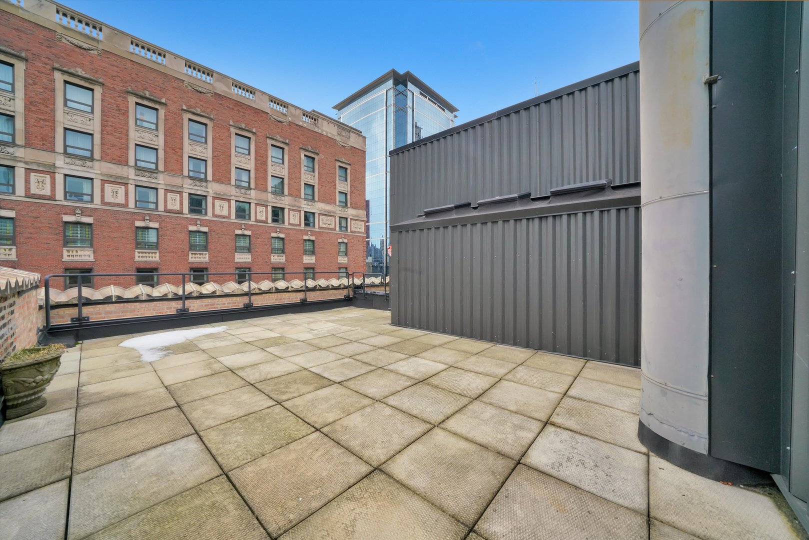 6 East Monroe Street, Unit 1501 Chicago, IL 60603 - Photo 19 of 27 a view of a building from a balcony