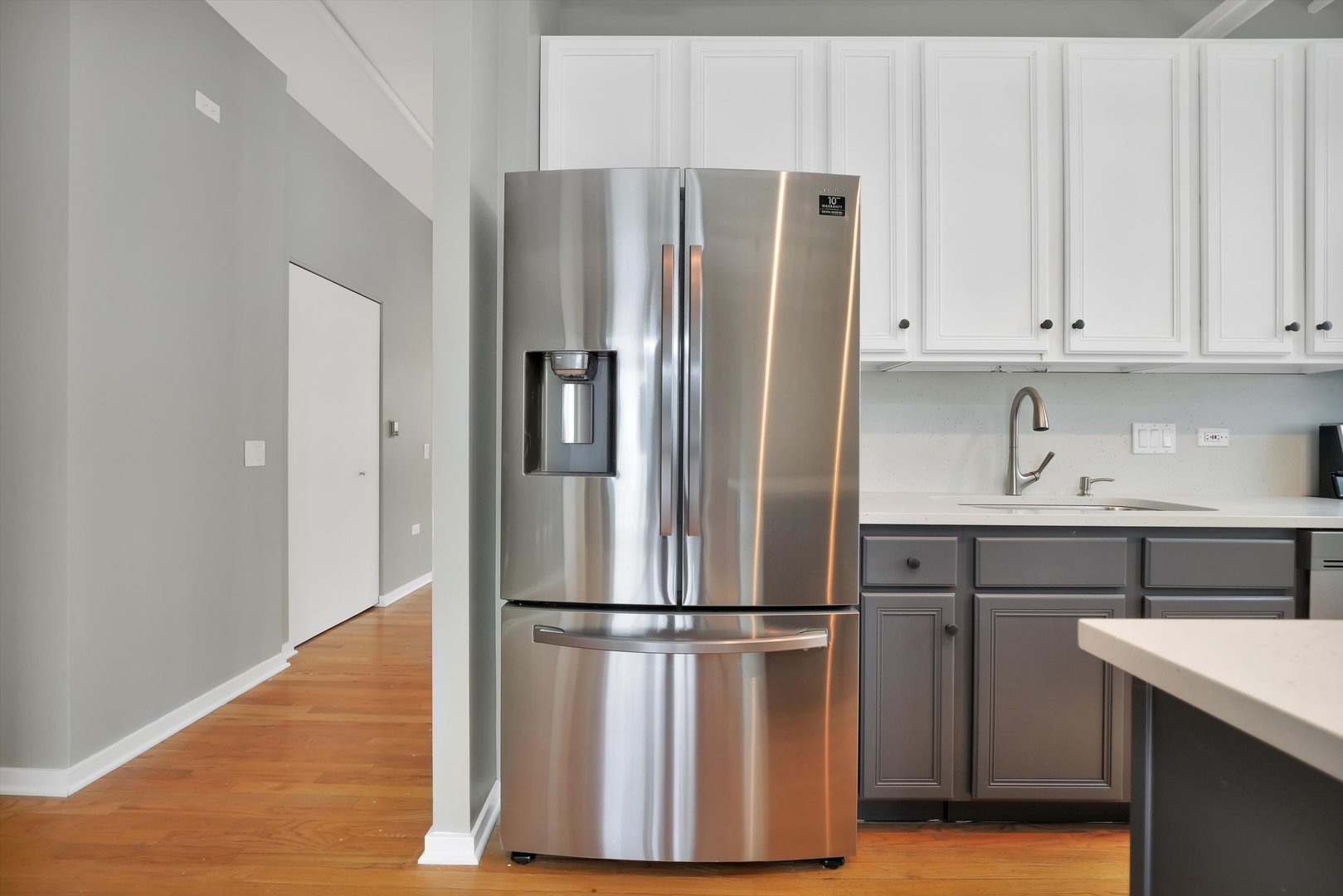 6 East Monroe Street, Unit 1501 Chicago, IL 60603 - Photo 3 of 27 a kitchen with stainless steel appliances a refrigerator and cabinets