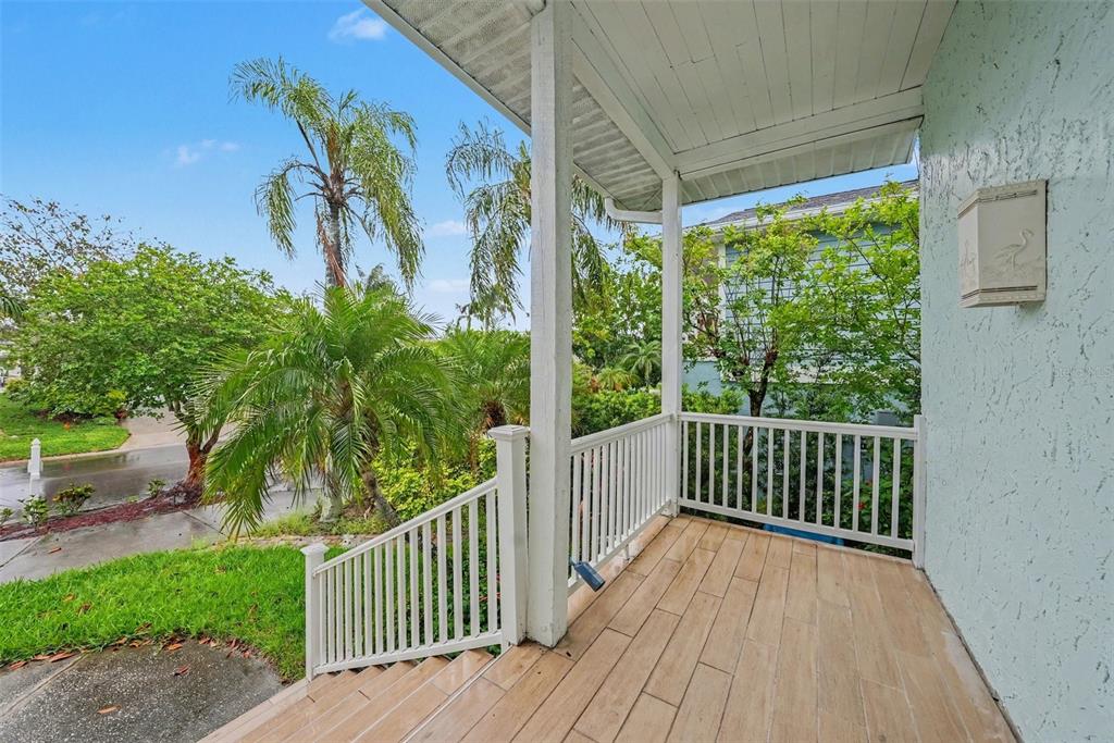 6225 Bayside Drive New Port Richey, FL 34652 - Photo 17 of 31 a view of a deck with wooden floor and fence