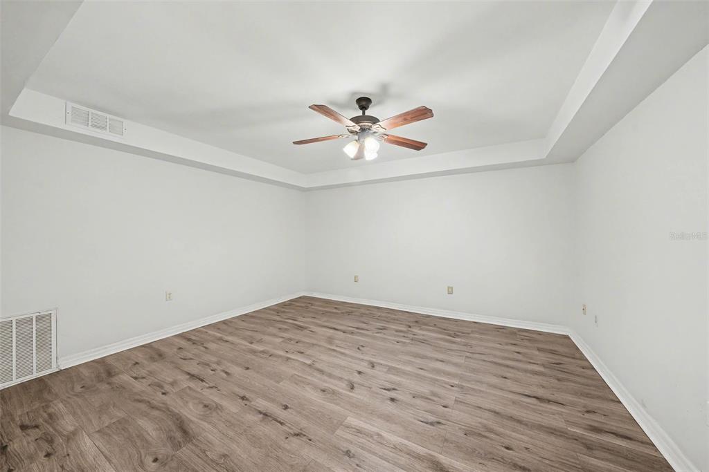 6225 Bayside Drive New Port Richey, FL 34652 - Photo 18 of 31 wooden floor in a empty room