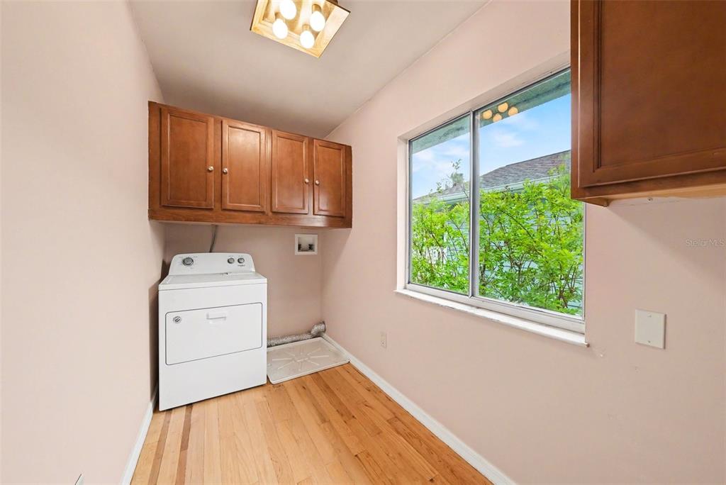 6225 Bayside Drive New Port Richey, FL 34652 - Photo 19 of 31 a view of a storage & utility room with washer and dryer