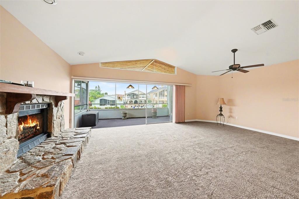 6225 Bayside Drive New Port Richey, FL 34652 - Photo 4 of 31 a view of a livingroom with furniture and a fireplace