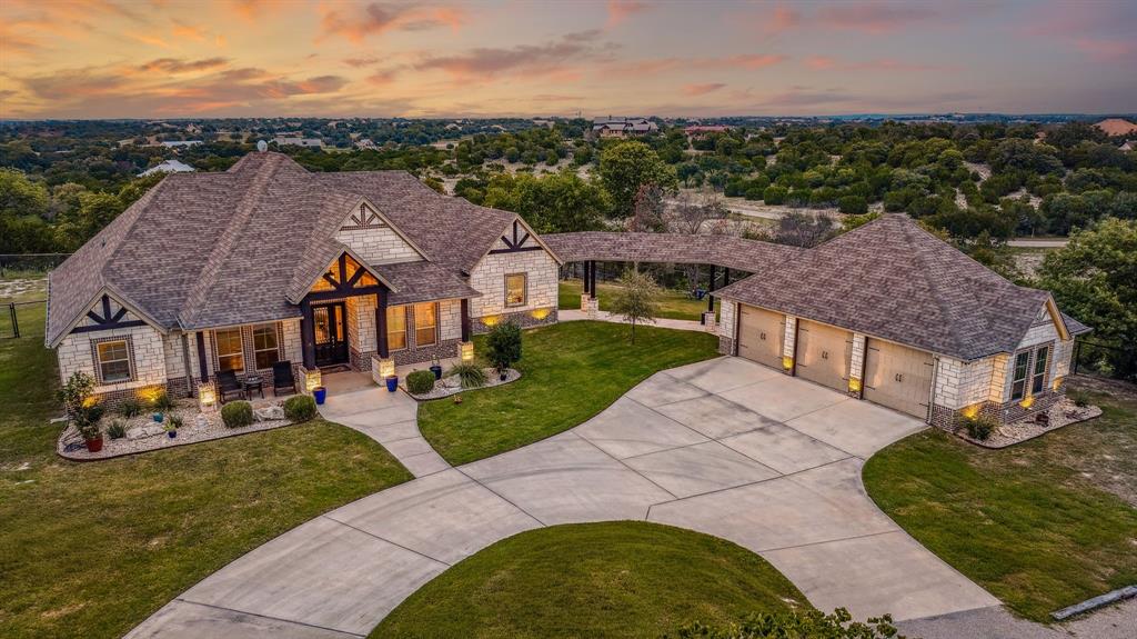 an aerial view of a house with garden space and street view
